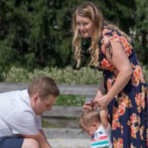 Parents with Toddler outside.