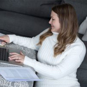 IABA Consultants ABA Telehealth Therapy. Image of an ABA Instructor using a computer to provide telehealth services.