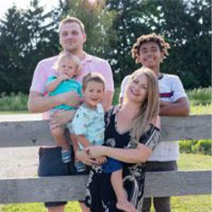 IABA owner Jessie Topalov and her family standing outside on the farm.