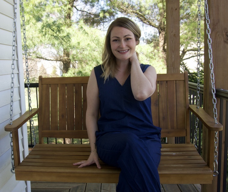 Fearless blog image. Photo of Jessie sitting on a swinging bench outside.