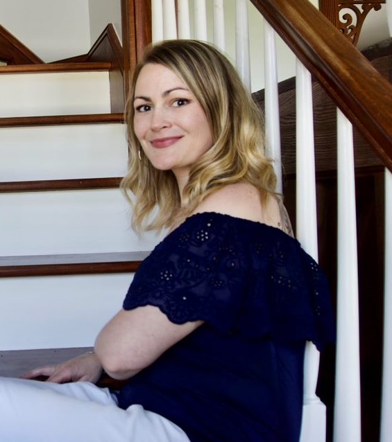 Awake blog featured image. Photo of Jessie, CEO of IABA Consultants, sitting on a staircase.