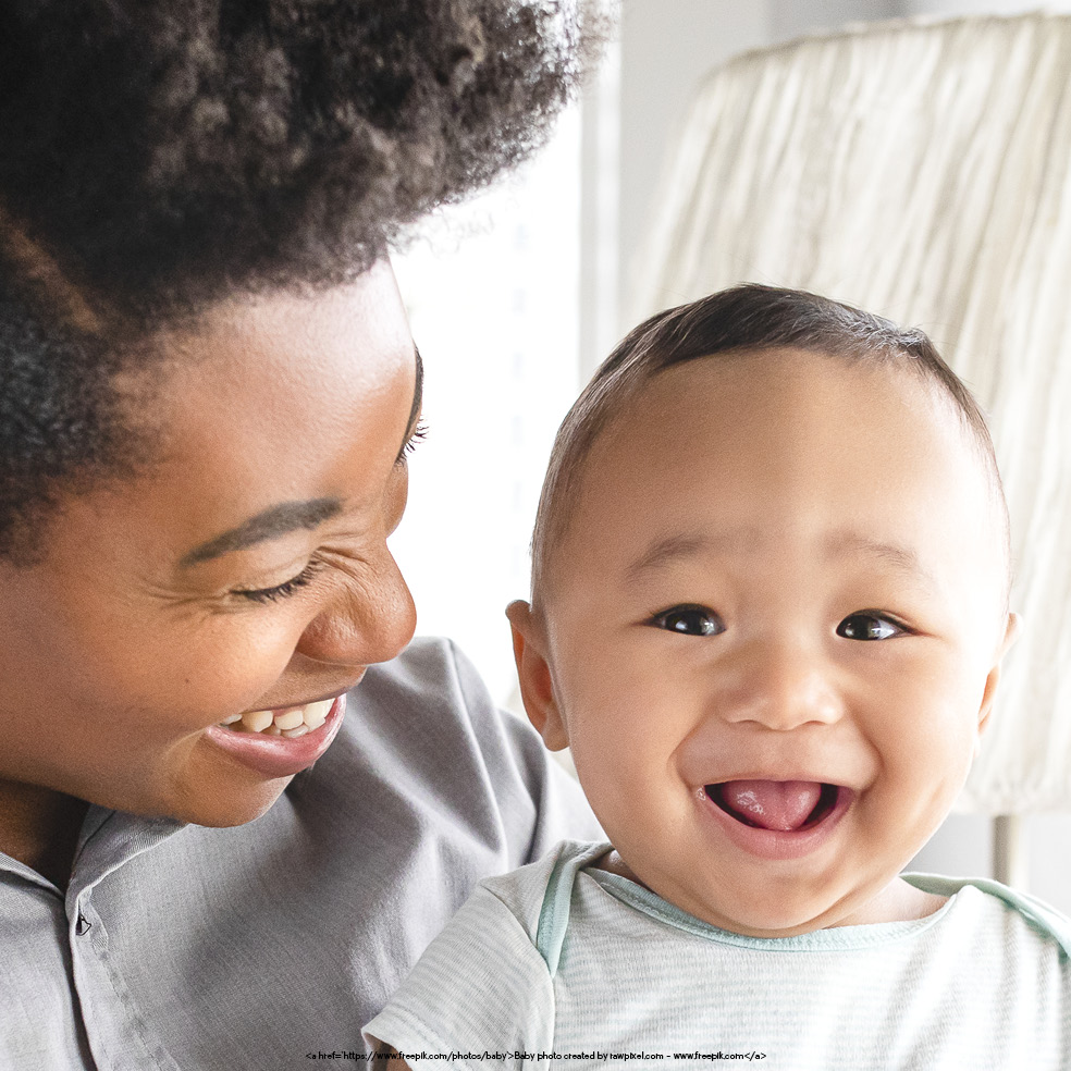 Autism Detection In Infants And Young Children blog. Photo of a woman holding a smiling baby.