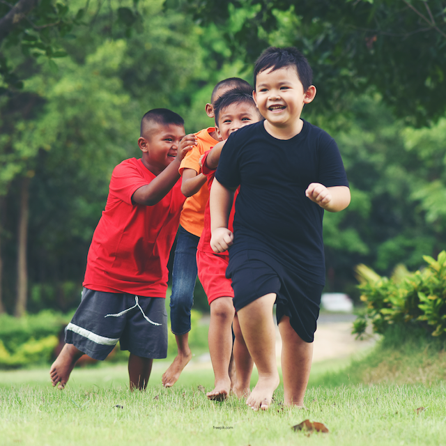 What is High Functioning Autism blog image. Photo of a bunch of young boys playing tag.