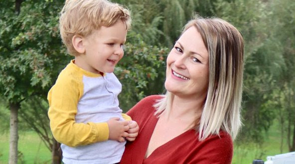 Boundaries on the Homefront blog. Photo of Jessie holding her youngest son outside.