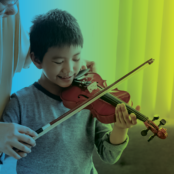 Finding After-School Programs for Children with Autism blog image. Photo of a young boy practicing violin.