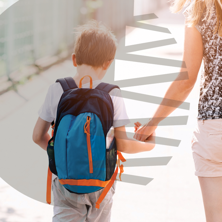 Making School Schedules Easier for People with Autism blog image. Photo of a young boy walking to school with his mother.